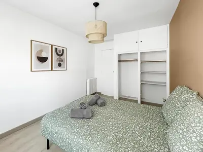 Un ou plusieurs lits dans un hébergement de l'établissement Appartement cosy, plage et parking privé