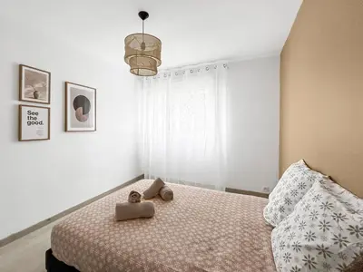 Un ou plusieurs lits dans un hébergement de l'établissement Appartement cosy, plage et parking privé
