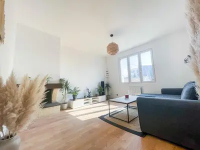 Coin salon dans l'établissement Appartement cosy proche Nantes