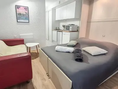 Un ou plusieurs lits dans un hébergement de l'établissement Studio cosy proche Nantes - parking