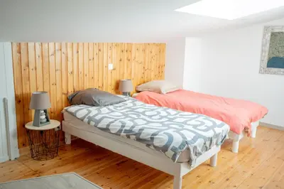 Un ou plusieurs lits dans un hébergement de l'établissement Maison Harmonie entre Ocean et Nature
