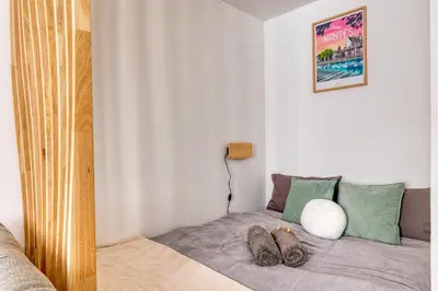 Un ou plusieurs lits dans un hébergement de l'établissement Le Petit RZ Studio élégant aux portes de Nantes