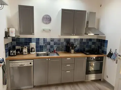 Cuisine ou kitchenette dans l'établissement Maison de vacances , idéale pour famille avec accès plage et spa
