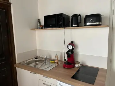 Cuisine ou kitchenette dans l'établissement T2 Centre ville - rdc