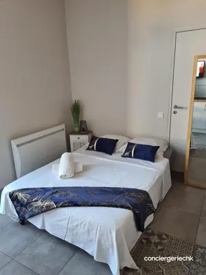 Un ou plusieurs lits dans un hébergement de l'établissement Les Glaneuses le Studio centre-bourg à 3 min du Puy duFou