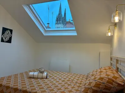 Un ou plusieurs lits dans un hébergement de l'établissement 2 chambre appartement avec vue sur la cathédrale - Coeur d'Angers