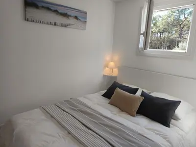 Un ou plusieurs lits dans un hébergement de l'établissement Maisonnette cosy à La Barre de Monts - 4 pers, parking - FR-1-540-326