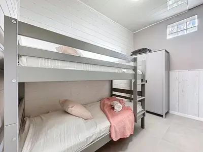 Un ou plusieurs lits dans un hébergement de l'établissement Holiday Home La Houle by Interhome