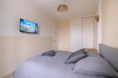 Un ou plusieurs lits dans un hébergement de l'établissement La Parenthèse - Proche Puy du Fo u - 2 appartements équipés et confortables au coeur des Herbiers