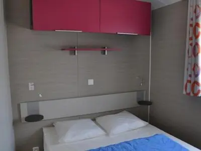Un ou plusieurs lits dans un hébergement de l'établissement Mobil-home 30m² avec terrasse à Saint-Hilaire-de-Riez - API-1-52-879