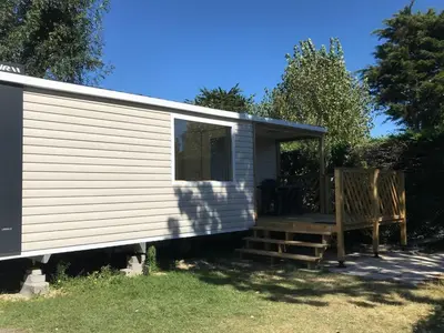 Jardin de l'établissement Mobil home à Saint-Jean-de-Monts avec terrasse - API-1-52-1099