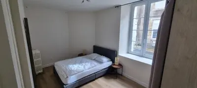 Un ou plusieurs lits dans un hébergement de l'établissement Appartement proche Grand Parc 1 Chambre