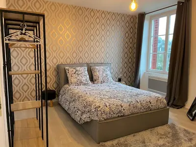 Un ou plusieurs lits dans un hébergement de l'établissement Petite maison au cœur de la ville