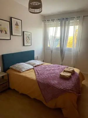 Un ou plusieurs lits dans un hébergement de l'établissement Appartement Tagada