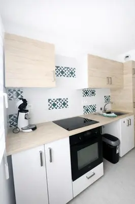 Cuisine ou kitchenette dans l'établissement Le Paul - Central et Charmant