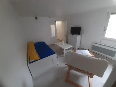 Télévision ou salle de divertissement dans l'établissement Maison 2 pièces avec jardin Nantes Beaujoire