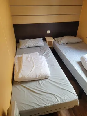 Un ou plusieurs lits dans un hébergement de l'établissement MH Bois Dormant 6 pers 3ch avec Lave Linge et TV