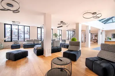 Coin salon dans l'établissement L'Atelier 23, Penthouse au coeur de Cholet