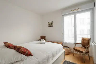 Un ou plusieurs lits dans un hébergement de l'établissement Appartement Calme en Centre-ville avec Parking