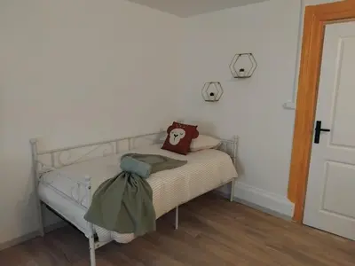 Un ou plusieurs lits dans un hébergement de l'établissement Au bon VERGER Appartement en coeur de ville hyper centre