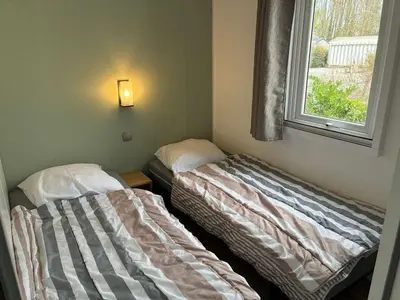 Un ou plusieurs lits dans un hébergement de l'établissement Le parc des roselieres 54 Saint Hilaire de Riez