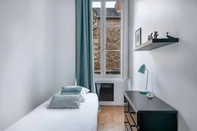 Un ou plusieurs lits dans un hébergement de l'établissement Bel appartement proche de la Place Graslin
