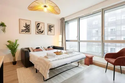 Un ou plusieurs lits dans un hébergement de l'établissement L'Interlude Nantais Appartement proche centre ville