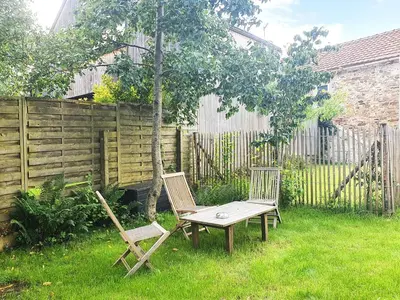 Jardin de l'établissement Maison plain-pied avec jardin