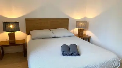 Un ou plusieurs lits dans un hébergement de l'établissement Maisonnette duplex