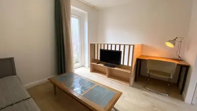 Télévision ou salle de divertissement dans l'établissement Maisonnette duplex