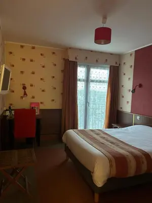 Un ou plusieurs lits dans un hébergement de l'établissement Hotel le France, Redon