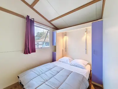 Un ou plusieurs lits dans un hébergement de l'établissement Chalet Ptit Kabana 1