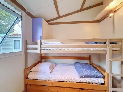Un ou plusieurs lits dans un hébergement de l'établissement Chalet Ptit Kabana 1