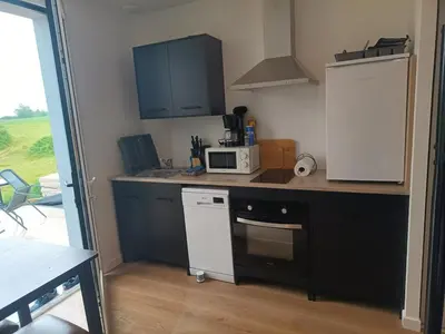 Cuisine ou kitchenette dans l'établissement Maison et studio 12 personnes 12 kilomètres du parc du puy du f