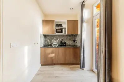 Cuisine ou kitchenette dans l'établissement La Citadelle - T2 Médiéval près de la Gare