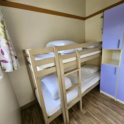 Un ou plusieurs lits dans un hébergement de l'établissement Chalet KABANA