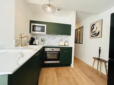 Cuisine ou kitchenette dans l'établissement Casa Belfort T2 avec Jardin