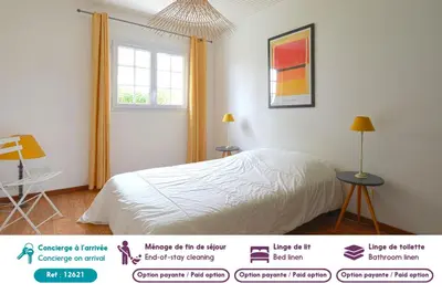 Un ou plusieurs lits dans un hébergement de l'établissement Maison conviviale pour 8 avec jardin à Noirmoutier