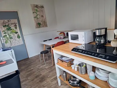 Cuisine ou kitchenette dans l'établissement Ecolodge au jardins de Koantiz