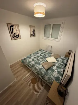 Un ou plusieurs lits dans un hébergement de l'établissement Appartement T2 cosy aux portes de Nantes
