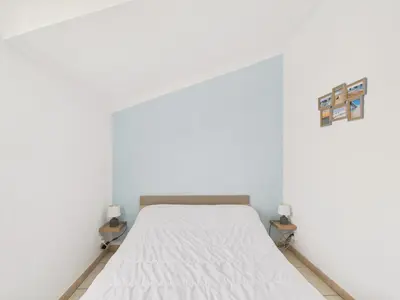 Un ou plusieurs lits dans un hébergement de l'établissement Maison pour 4 avec terrasse à 200m de la plage