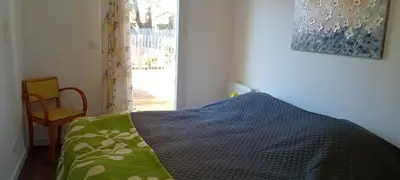 Un ou plusieurs lits dans un hébergement de l'établissement Maison Sous Les Chênes