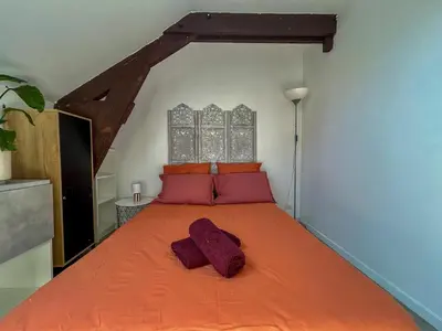 Un ou plusieurs lits dans un hébergement de l'établissement Studio Bord de Loire - Couëron