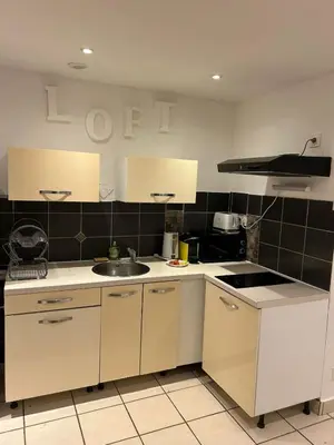 Cuisine ou kitchenette dans l'établissement Le Côté Plage - Saint-Nazaire