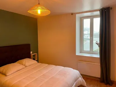 Un ou plusieurs lits dans un hébergement de l'établissement Maison Pautin