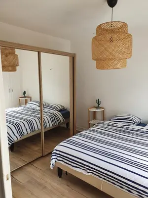 Un ou plusieurs lits dans un hébergement de l'établissement Résidence le grand Hôtel