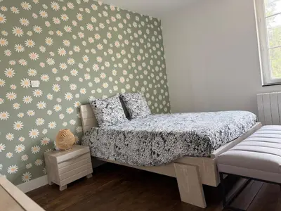 Un ou plusieurs lits dans un hébergement de l'établissement Maison sur les hauteurs de la ville