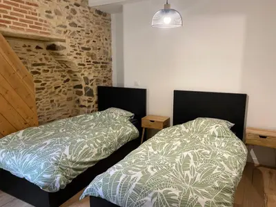 Un ou plusieurs lits dans un hébergement de l'établissement Appartement Le Pellerin 2ch et 2sdb