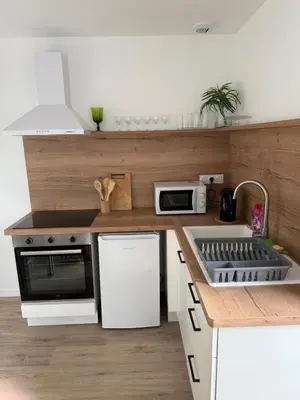 Cuisine ou kitchenette dans l'établissement appartement centre ville Le Grand-Fougeray