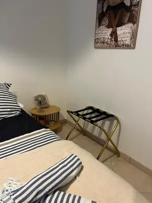 Un ou plusieurs lits dans un hébergement de l'établissement Maison cosy 2 chambres avec piscine proche mer golf Pornic